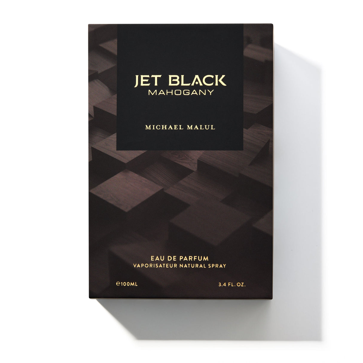 Michael Malul Jet Black Mahogany cologne bottle shown beside its outer packaging box