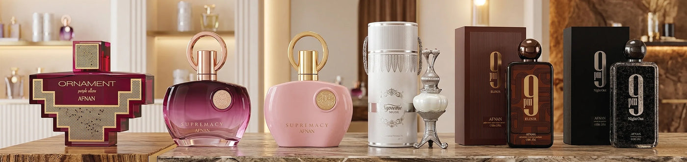 Afnan Perfumes laid on a beige marble surface. Ornament, Supremacy, Supreme, 9pm, and 9pm Night Out