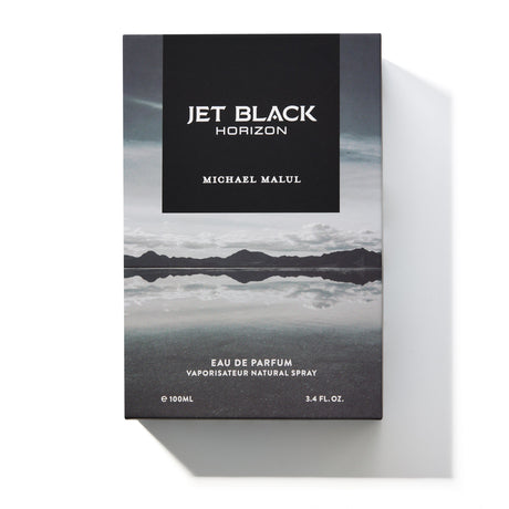 Michael Malul Jet Black Horizon cologne bottle shown beside its outer packaging box