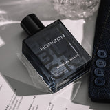 Michael Malul Jet Black Horizon Eau de Parfum styled against a dark city-night backdrop