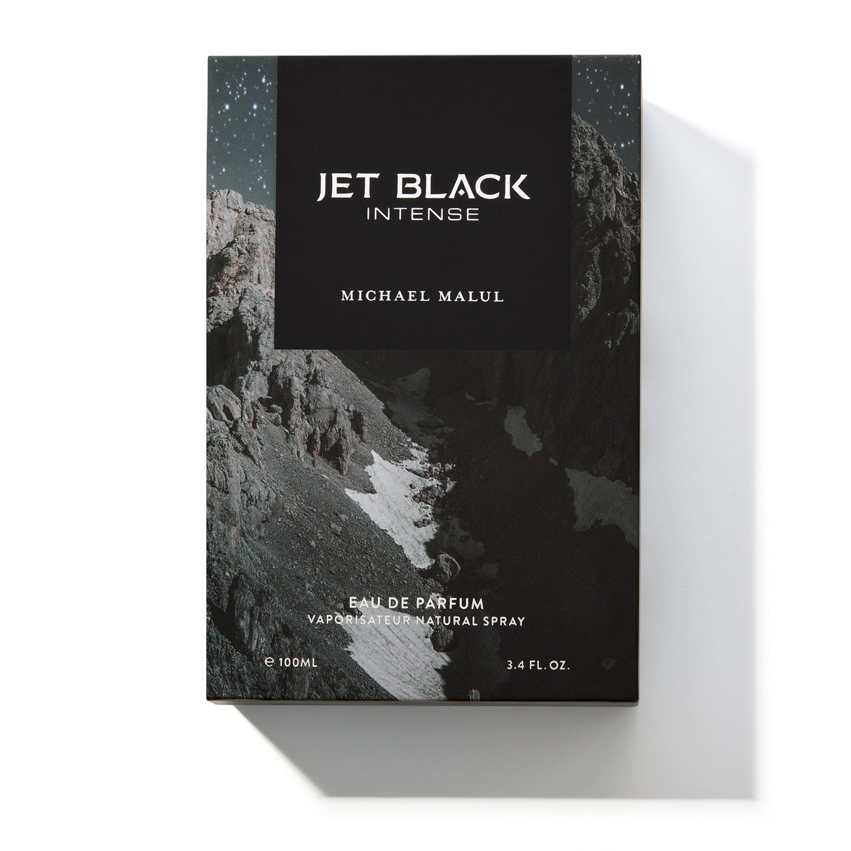 Michael Malul Jet Black Intense cologne bottle shown beside its black outer packaging box