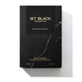 Michael Malul Jet Black Reserve cologne bottle shown beside its outer packaging box