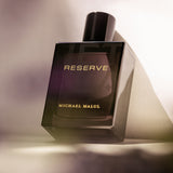 Michael Malul Jet Black Reserve Eau de Parfum styled on a dark background