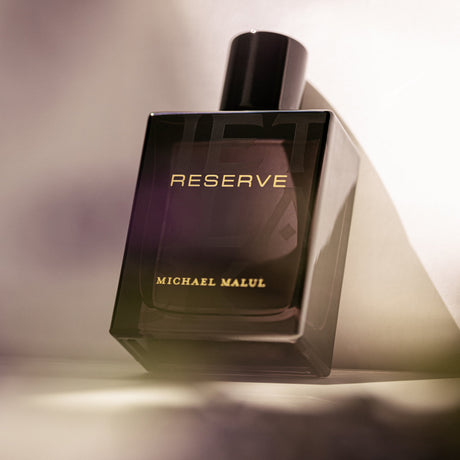 Michael Malul Jet Black Reserve Eau de Parfum styled on a dark background
