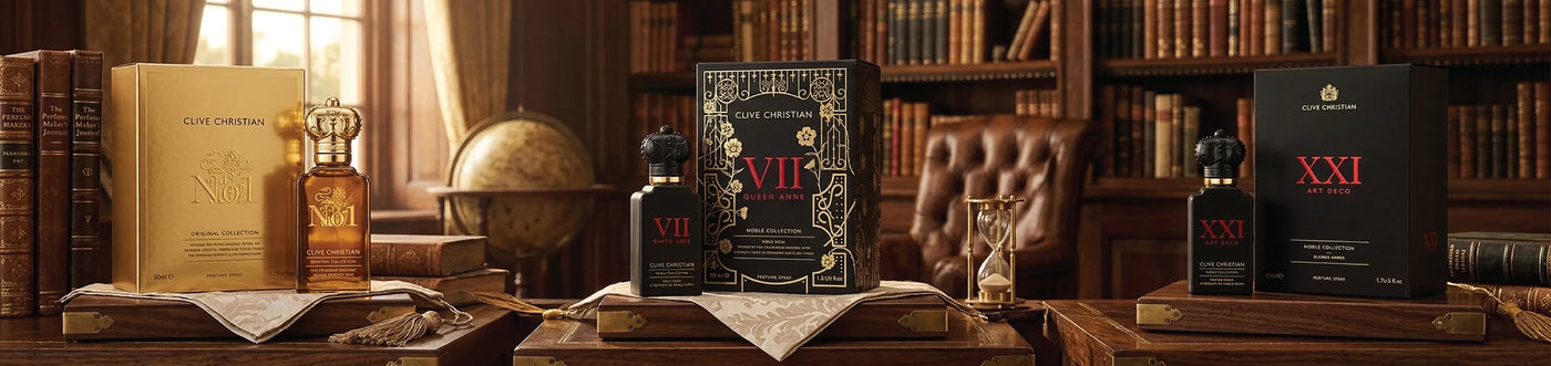 Three Clive Christian bottles in a wooden surface in a library with a globe in the background.